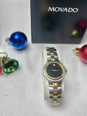 Movado two tone lady's black dial bracelet watch